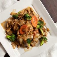 Pad See Ew · Wide rice noodle stir-fried with egg, carrots, and broccoli in a sweet soy sauce.