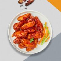 Classic Buffalo Wings · Eight classic buffalo wings (medium heat), served with carrots & celery and a choice of blue...