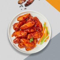 Hot Honey Wings · Eight hot honey wings (medium heat), served with carrots & celery and a choice of blue chees...