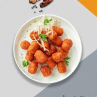 Sweet Potato Tots · (Vegetarian) Shredded sweet potatoes formed into tots, battered, and fried until golden brown.