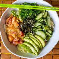 Spicy Poke Bowl · In bowl: rice, lettuce, cucumber, avocado, seaweed salad, salmon, tuna sauce: spicy poke sau...