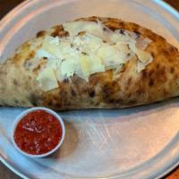 Bubba · Calzone stuffed with pesto, beef pepperoni tidbits, green olives. No red sauce inside.