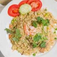 Thai Fried Rice · rice wok-fried with eggs, onions, , and your choice of protein, garnished .