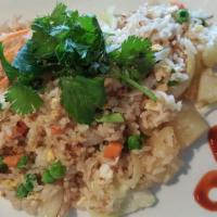 Pineapple Fried Rice · rice, pineapple, , eggs, and sweet onions wok-fried with a touch of yellow curry powder, wit...