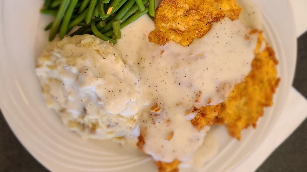 Chicken Fried Chicken · Hand battered boneless chicken breast,fried and topped with Homemade cream gravy or our spicy jalapeno cream gravy