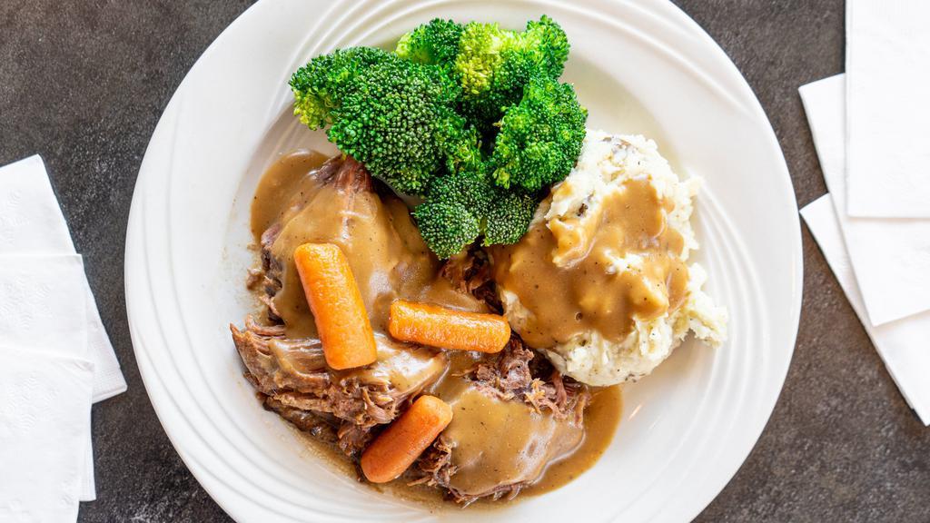 Pot Roast · Slow roasted pot roast topped with brown gravy