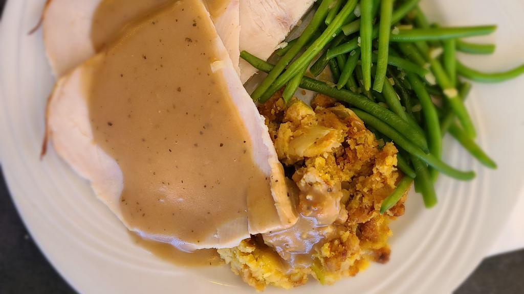 Roasted Turkey Breast Dinner · A Generous portion of hand carved roasted turkey breast, served with our Cornbread dressing and Homemade Turkey Gravy.