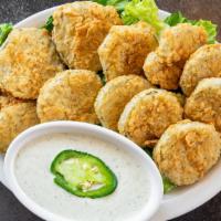 Fried Pickles · Black-eyed Pea Southern favorite. Golden Fried Pickle Chips served with your choice of dippi...