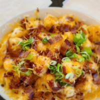 Loaded Tater Tots · Crispy tater tots loaded with melted cheese, crispy bacon and fresh chopped green onions. Se...