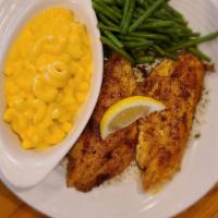 Grilled Cajun Catfish · Two tender farm-raised fillets, coated with our spicy Cajun seasoning, then grill and served...