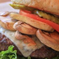 Sautéed Mushroom Swiss Burger · Cooked Medium Well and served with tomato, lettuce, pickles on a whole wheat bun with your c...