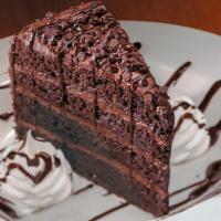 Mile High Chocolate Cake · Our Famous one Pound layered Chocolate Cake with Caramel and Chocolate Sauce.