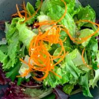 House Salad · Fresh chopped lettuce and shredded carrots with vinaigrette sesame dressing.