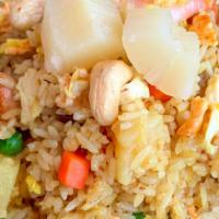 Panna Pineapple Fried Rice · Combination of chicken and shrimp, eggs, peas and carrots, raisins, cashew nuts, and pineapp...
