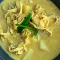 Yellow Curry · Coconut milk with mild yellow curry, Thai herbs, and potatoes.