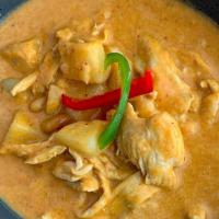 Massaman Curry · Coconut milk with Thai massaman curry, Thai herbs and spices, peanuts, onion, potatoes.