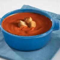 Tomato Soup · A traditional tomato soup made with vegetable broth finished with heavy cream.