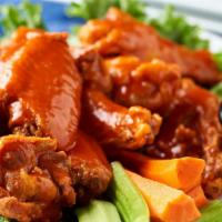 Hot Wings · Jumbo wings tossed with a spicy buffalo or BBQ sauce and served with blue cheese dressing.