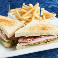 Clubhouse Sandwich · Smoked turkey breast, black forest ham, applewood bacon, lettuce, tomato, Swiss cheese and h...