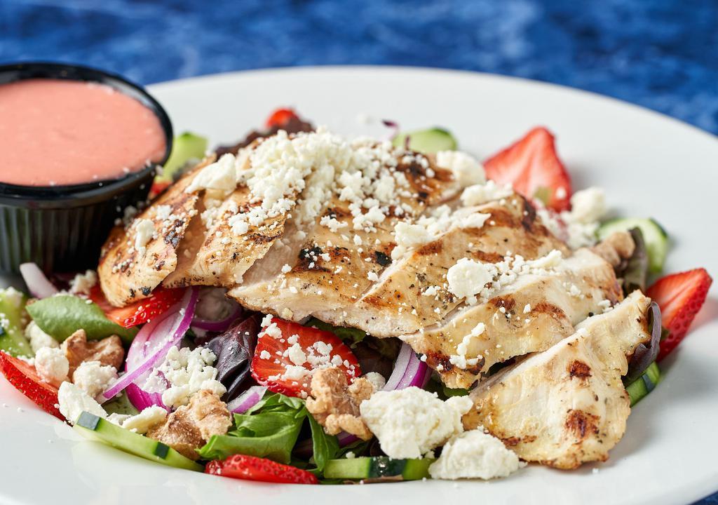 Strawberry Salad · Favorite. All natural grilled chicken breast, mixed greens, cucumbers, feta cheese, red onions, candied walnuts and fresh strawberries with a strawberry vinaigrette.