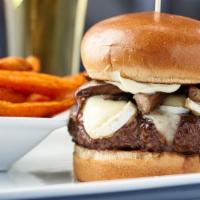 Truffle Brie Burger · A half pound of our black Angus beef, topped with brie cheese, sautéed Portobello mushrooms ...