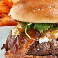 Metropolitan Burger · A half pound of our black Angus beef, topped with Goat cheese, Applewood smoked bacon, caram...
