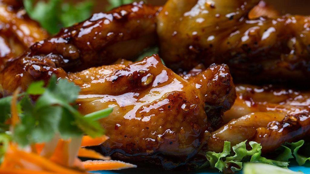 Wow Wow Chicken Wings /  Cánh Gà · Vietnamese style chicken wings caramelized in garlic and sweetened fish sauce