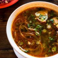 Hue Spicy Soup / Bún Bò Huế · Spicy lemongrass soup with shank beef, lean pork roll, thick rice noodles, and fresh vegetab...