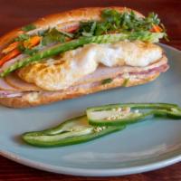 Xinhxinh Bánh Mì · French baguette with house-made mayonnaise, cucumber, pickled daikon-carrots, lean pork roll...