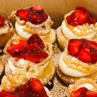 Strawberry Funnel Cake  · Vanilla flavored cake with a house made whipped cream. Topped with strawberry compote and st...
