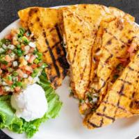 Quesadillas · Grilled Chipotle tortilla filled with Cheddar, Monterey Jack cheese and Pico de Gallo. Serve...