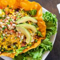 Chipotle Fiesta Salad · A fresh Chipotle tortilla bowl with Fresh mixed greens, corn, Red Beans (contains pork) shre...