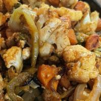 Veggie Fajitas · Delivered on a hotbed of sautéed onions, bell peppers, tomatoes, corn, mushrooms, zucchini, ...