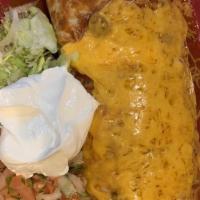 Chorizo Burrito · A flour tortilla filled with chorizo, scrambled eggs, rice and beans topped with our own spe...