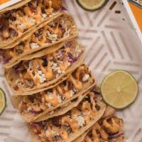 Tacos (2) · All tacos are served on a warm tortilla (your choice of flour or corn) and topped with cabba...