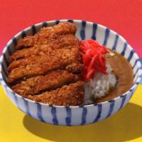 Pork Katsu Curry Over Rice · Crispy breaded pork with Japanese curry sauce over rice.