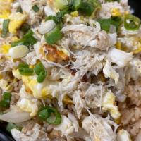 Crab Fried Rice · Crab meat, egg, green onion, cucumber, yellow onions,  garlic, white pepper & lime.