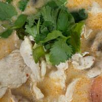Tom Kha Soup (Gf) · House coconut milk soup; tomato, mushroom, onion, cilantro.