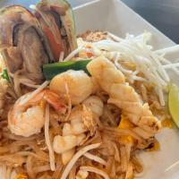 Pad Thai  · Thin rice noodles, bean sprout, green onion, red  onion, radish, egg, peanuts served with li...