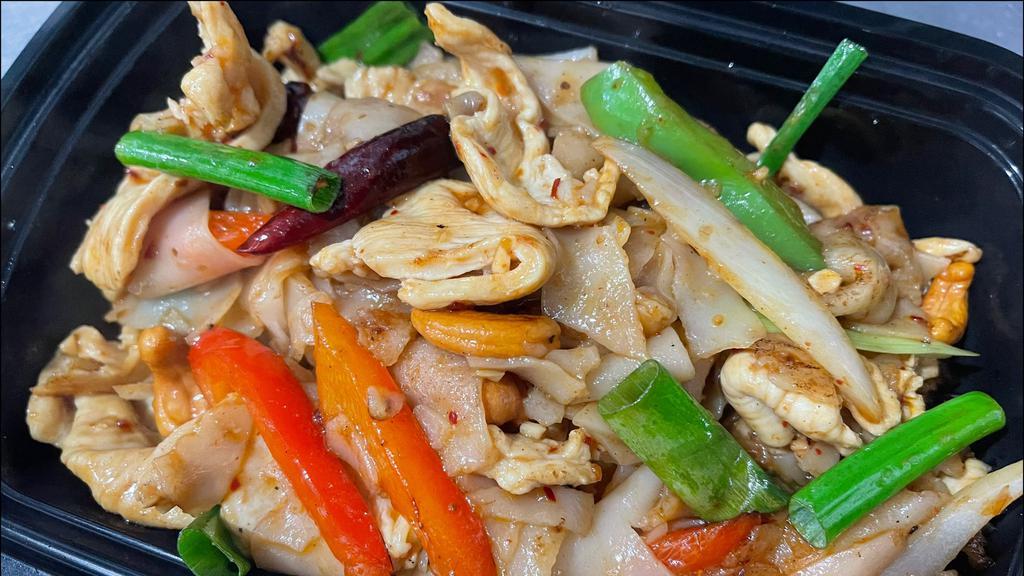Cashew Nut Noodle  · Wide rice noodles, bell pepper, yellow onions,  green onions, carrots, chili paste, cashew nuts, dried chilies, white pepper.