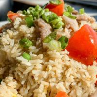 House Fried Rice · Egg, peas, carrots, green onion,  yellow onion, tomato, cucumber, white pepper.
