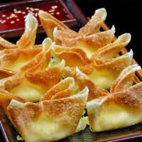 Cream Cheese Wonton - 6Pcs. · Serve with Sweet and Sour sauce, top with Sesame seeds.