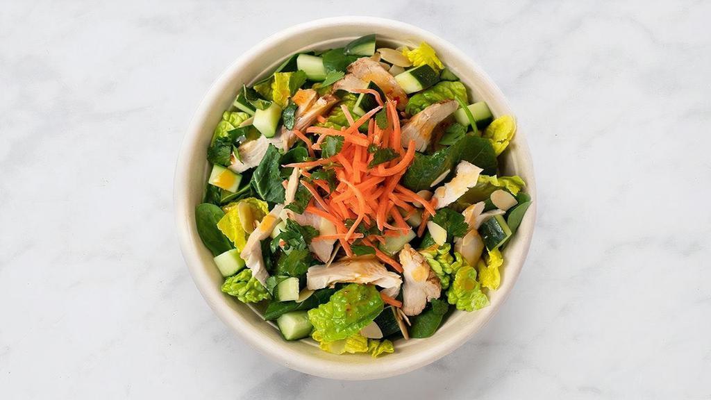 Sweet Thai Chicken · lively greens, chicken, pickled carrots, chopped cilantro, diced cucumbers, sliced almonds and sweet thai dressing