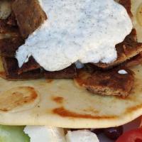 Gyro Plate · Gyro meat on pita with tzatziki & served with onion, tomato, cucumber, feta & olives.