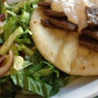Gyro Deluxe · Gyro meat on pita with tzatziki & served with a small Greek salad.