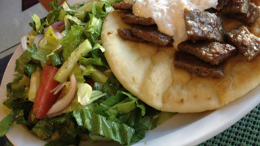 Gyro Deluxe · Gyro meat on pita with tzatziki & served with a small Greek salad.
