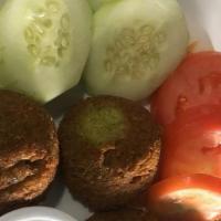 Falafel Plate · 4 garbanzo & parsley balls, fried & spiced with cumin. Served with 2
choices of: hummus, hou...