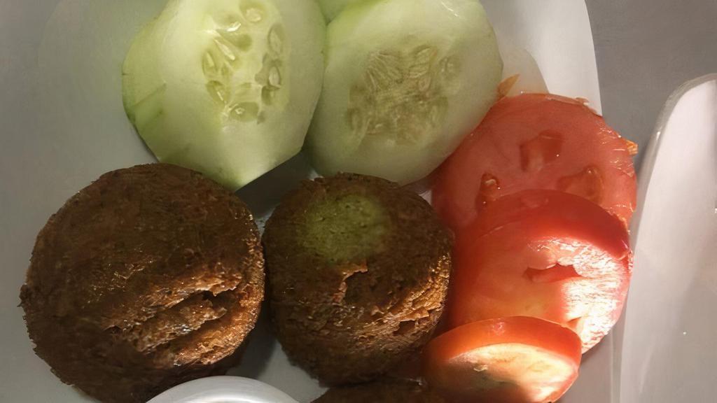 Falafel Plate · 4 garbanzo & parsley balls, fried & spiced with cumin. Served with 2
choices of: hummus, house salad, motobal (baba ganoush) or rice.