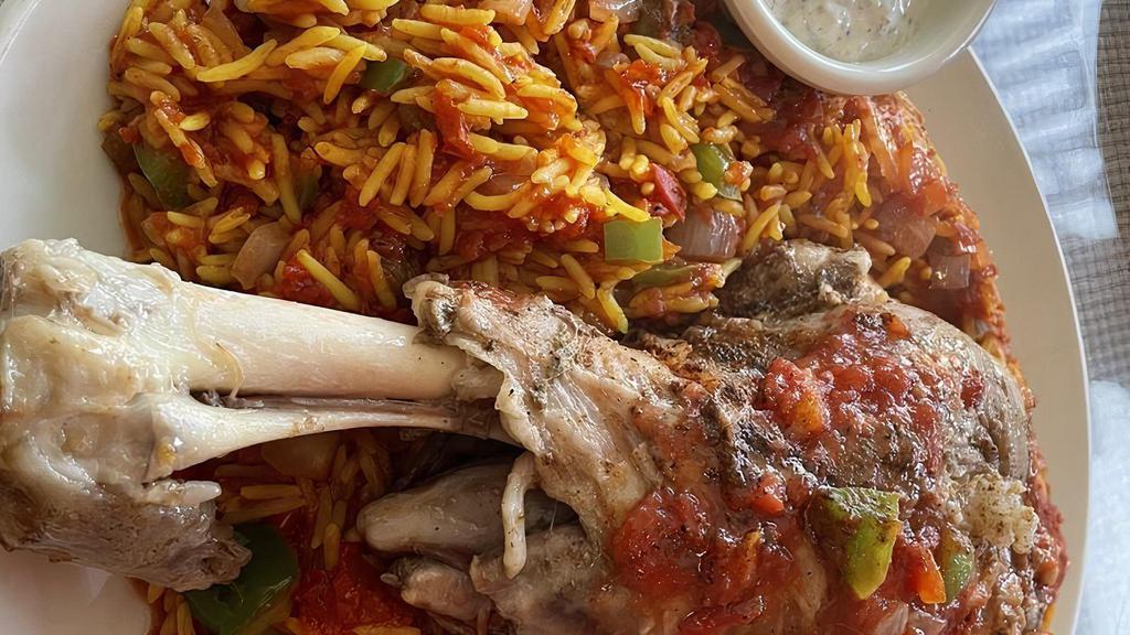 Kabsa · A traditional Bedouin dish of your choice of meat, rice, sautéed diced onions, bell pepper, garlic, herbs & tomato sauce. Served with a side of yogurt sauce or house salad