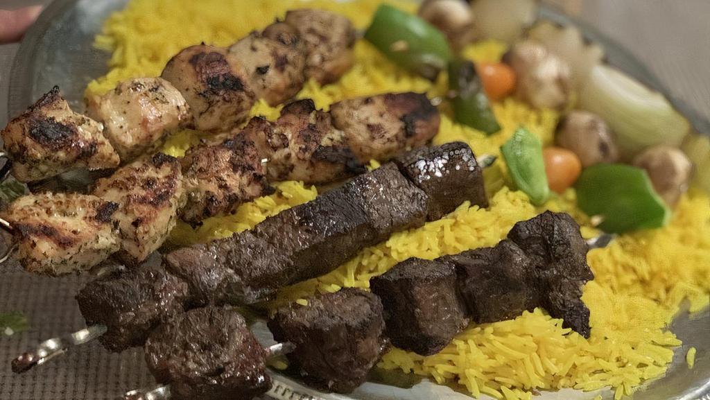 Family Kebabs · Comes with 4 skewers of meat (choice of chicken, beef$1, lamb $3, and kafta$1) & veggie kebabs. Served with large rice & large house salad, and pita.